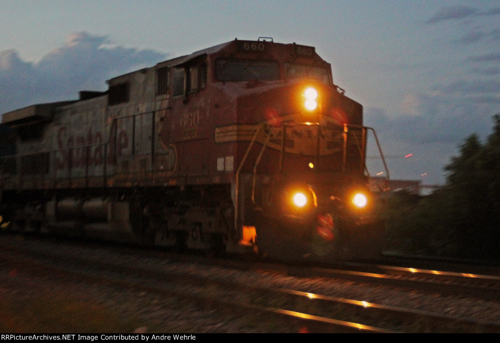 A slow shutter speed and some panning is required to capture BNSF 660 leading #8 out of town